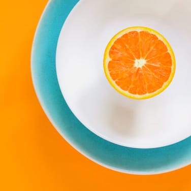 Half orange on a plate